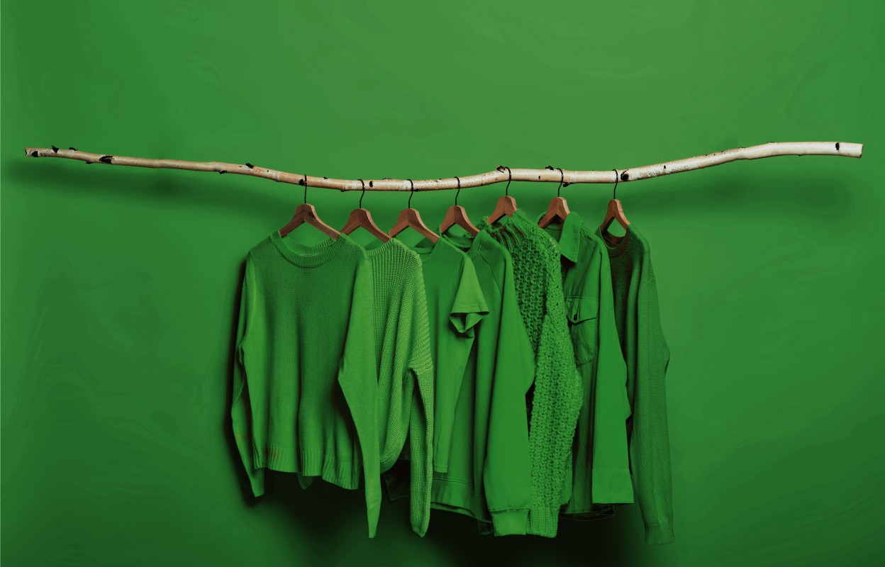 green clothing assortment on hangers